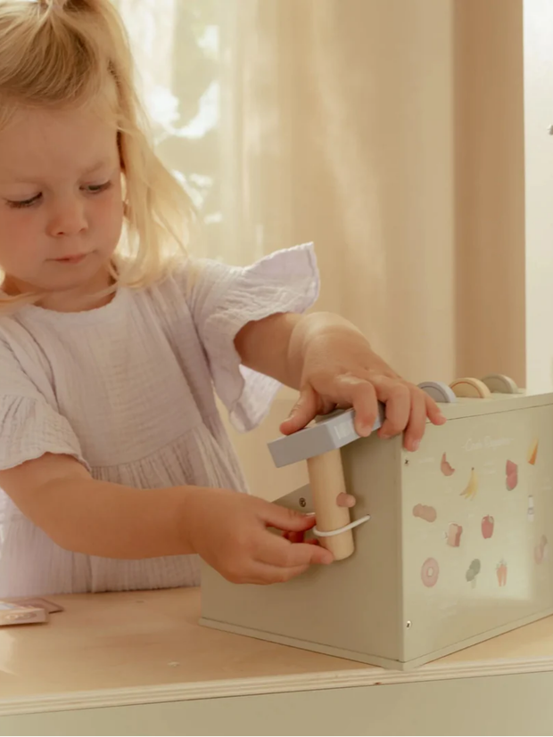 Little Dutch Wooden Cash Register Toy for Kids in use, a child playing creatively with educational toy.